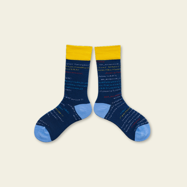 Pair of blue socks with yellow accents on a beige background