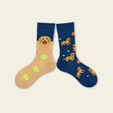 Two pairs of socks with dog designs on a beige background