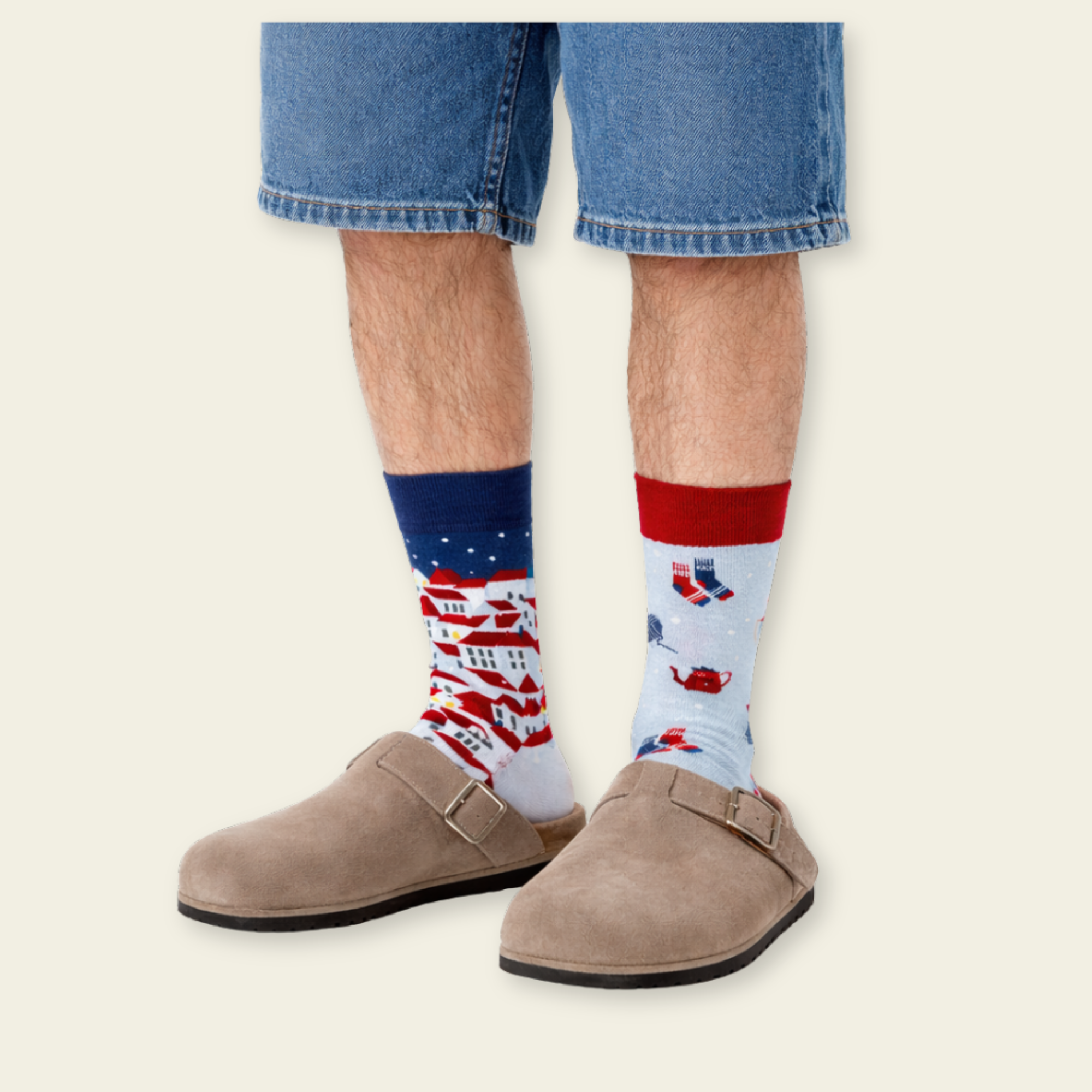 Person wearing colorful socks with a plain background
