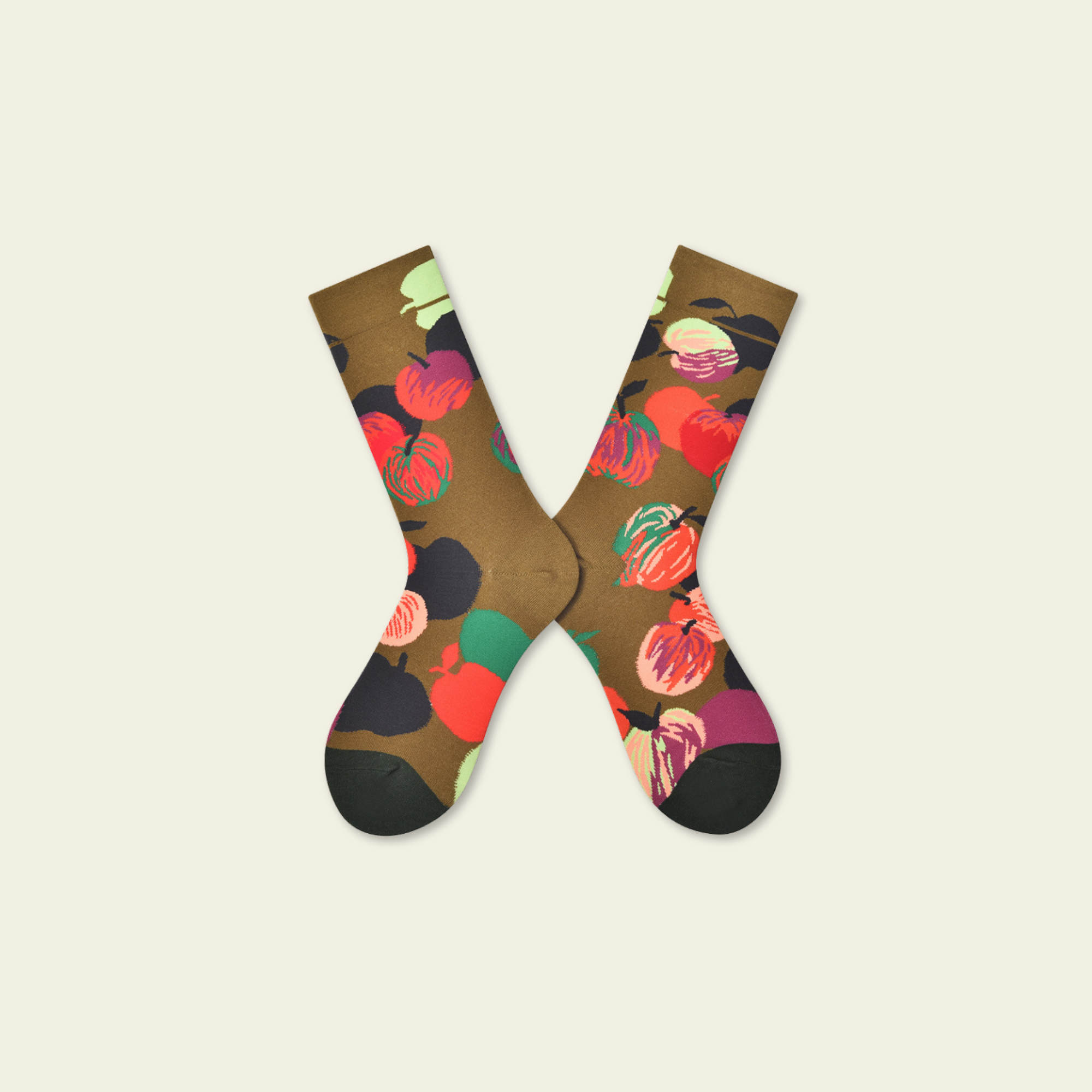 Pair of socks with a colorful fruit pattern on a beige background